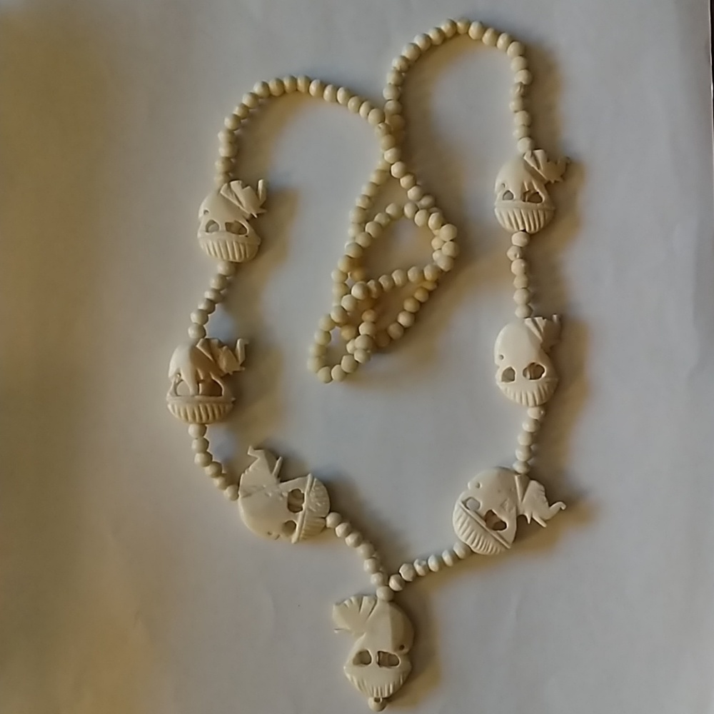 Vintage Ivory colored elephant necklace.